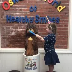 oswald the beaver with patient and dentist 12